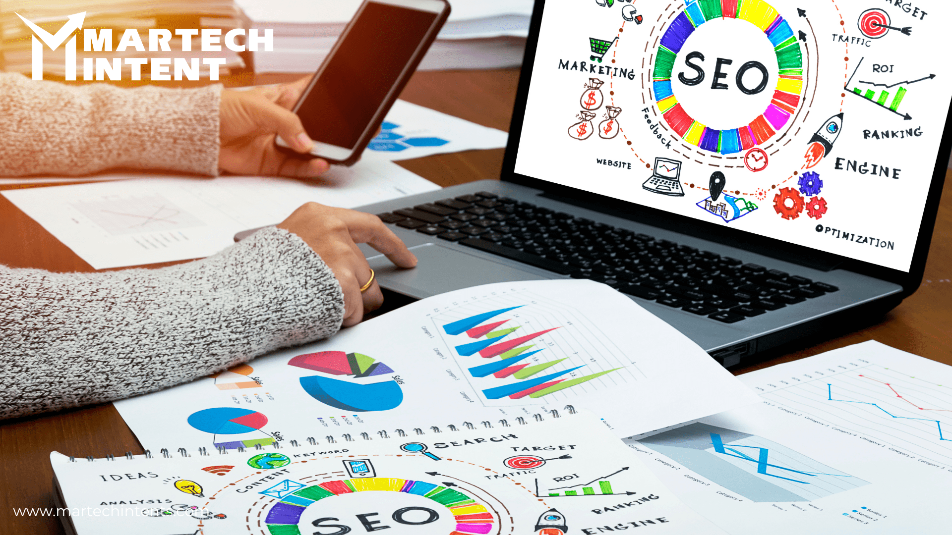 A picture showing SEO and person holding phone